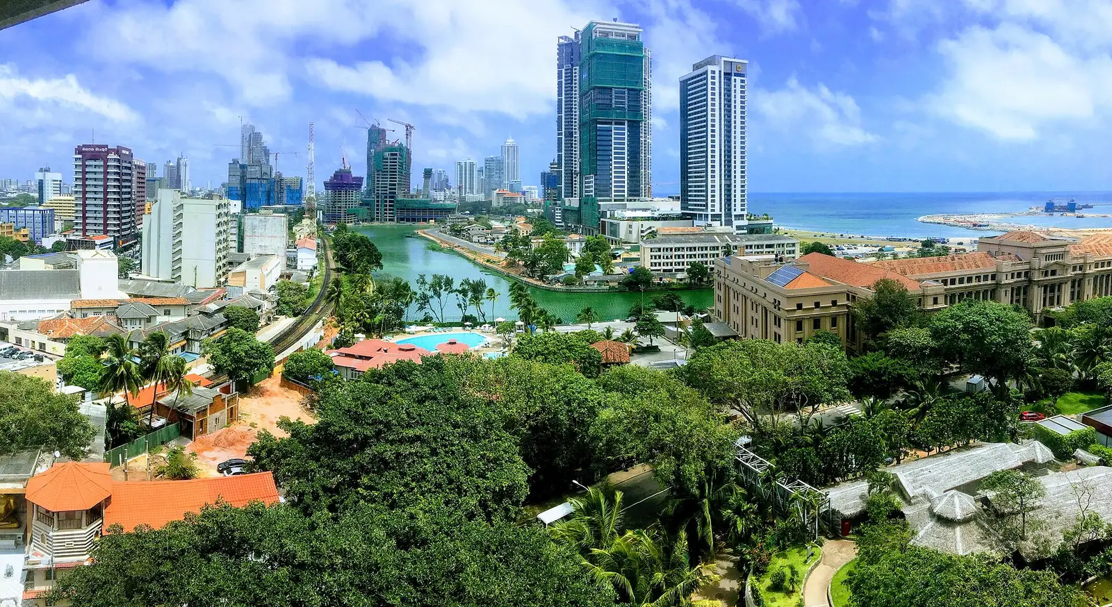 Colombo city skyline with green trees in the foreground