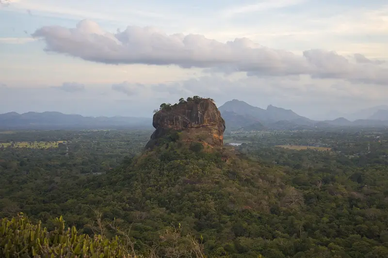 Sigiriya rock seen across green countryside